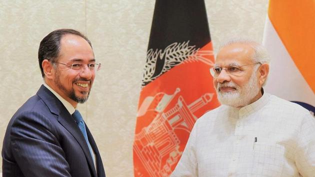 Prime Minister Narendra Modi (L) with foreign minister of Afghanistan, Salahuddin Rabbani, in a meeting in New Delhi on Monday.(PTI)