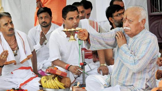 RSS chief Mohan Bhagwat offers prayers to Ganga River as he celebrates his birthday with sadhus, in Haridwar on Monday. (PTI Photo) RSS chief Mohan Bhagwat offers prayers to Ganga River as he celebrates his birthday with sadhus, in Haridwar on Monday. (PTI Photo)