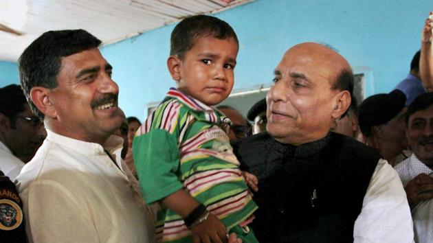 Union home minister Rajnath Singh interacts with a child during his visit to a border migrants camp in Naushera sector of Rajouri district on Monday. (PTI Photo) Union home minister Rajnath Singh interacts with a child during his visit to a border migrants camp in Naushera sector of Rajouri district on Monday. (PTI Photo)