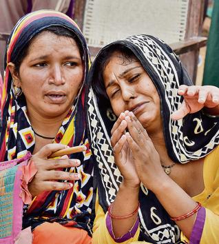 The accused’s wife Mamta (right) at her home in Ghamroj village on Monday.(Sanjeev Verma/HT PHOTO)