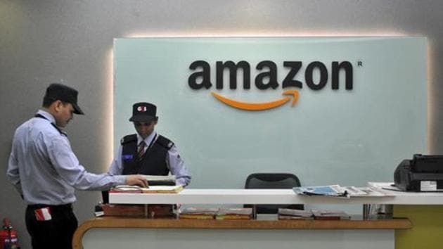Security guards stand at the reception desk of the Amazon India office in Bengaluru. (Reuters file) Security guards stand at the reception desk of the Amazon India office in Bengaluru. (Reuters file)