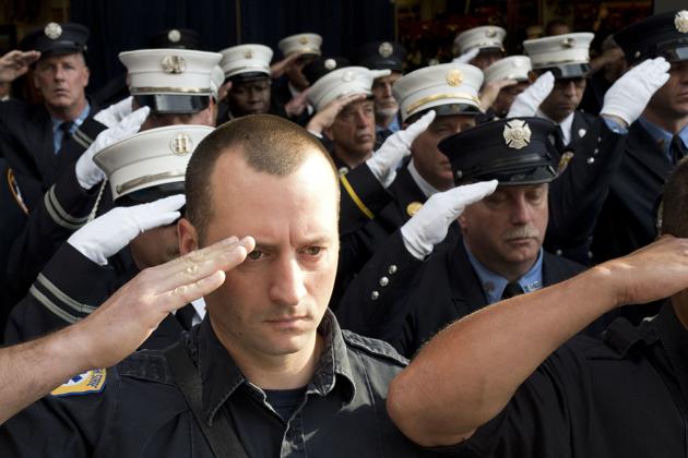 New York City firefighters with Ladder 10 Engine 10 firehouse salute during the moment of silence at the World Trade Center in New York. During the attacks of 9/11, 343 firefighters were killed. (Mark Lennihan / AP) New York City firefighters with Ladder 10 Engine 10 firehouse salute during the moment of silence at the World Trade Center in New York. During the attacks of 9/11, 343 firefighters were killed. (Mark Lennihan / AP)