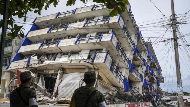 Soldiers stand guard a few metres away from the Sensacion hotel which collapsed with the powerful earthquake that struck Mexico overnight, in Matias Romero, Oaxaca State, on September 8, 2017. A tsunami was confirmed in Mexico, with one wave coming in at 5.8 feet (1.75 meter), according to the Pacific Tsunami Warning Center. Tsunami warnings were issued as far away as New Zealand and Vanuatu. (Vicoria Razo / AFP) Soldiers stand guard a few metres away from the Sensacion hotel which collapsed with the powerful earthquake that struck Mexico overnight, in Matias Romero, Oaxaca State, on September 8, 2017. A tsunami was confirmed in Mexico, with one wave coming in at 5.8 feet (1.75 meter), according to the Pacific Tsunami Warning Center. Tsunami warnings were issued as far away as New Zealand and Vanuatu. (Vicoria Razo / AFP)