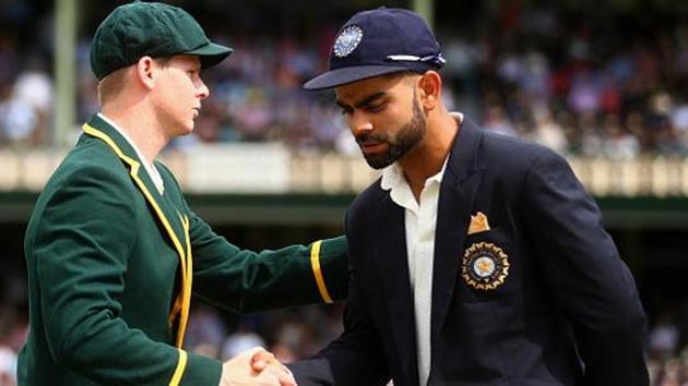Steve Smith shakes hands with Virat Kohli (R) on day one of the fourth Test match between Australia and India at Sydney Cricket Ground on January 6, 2015. India host Australia for a five-ODI and three T20 series starting September 17.(Cricket Australia/Getty Images)