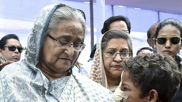 Bangladeshi Prime Minister Sheikh Hasina meets with a Rohingya Muslim child at Kutupalong refugee camp, near the border town of Ukhia, Bangladesh on Tuesday. (AP Photo) Bangladeshi Prime Minister Sheikh Hasina meets with a Rohingya Muslim child at Kutupalong refugee camp, near the border town of Ukhia, Bangladesh on Tuesday. (AP Photo)
