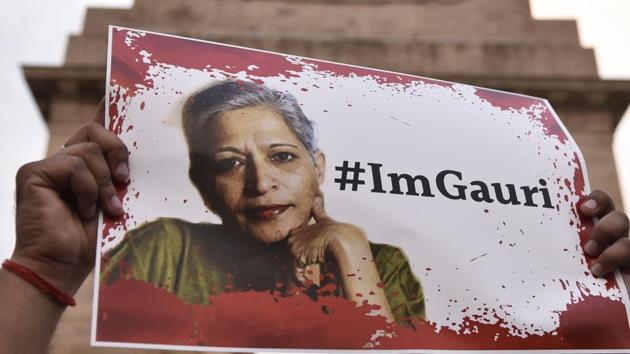 A candle-light vigil in memory of journalist Gauri Lankesh. Lankesh’s murder cannot merely feed the mills of gossip, of family quarrels, of CBI incompetence, of politicians shedding crocodile tears. Democracy and civil society need to be more inventive.(Burhaan Kinu/HT PHOTO)