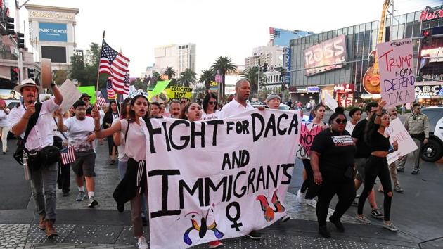 Immigrants and supporters march on the Las Vegas Strip during a We Rise for the Dream rally to oppose US President Donald Trump's order to end DACA, on Sunday.(AFP)
