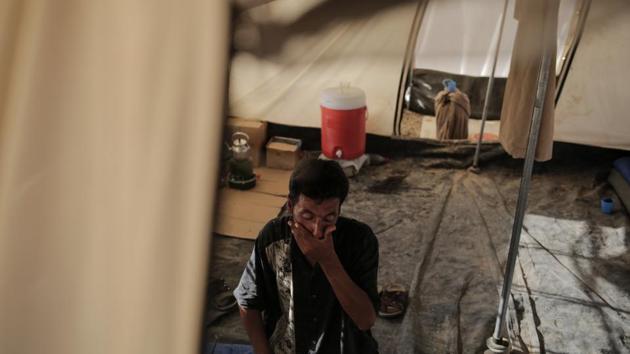 Abu Abdullah Fathi from west Mosul sits inside his tent in the Chamokor camp. His family can’t return to their home in the Tanak neighbourhood after it was destroyed by an air strike. Sunni Arabs have struggled since the 2003 US-led invasion, which toppled Saddam Hussein and opened the door for the Shiite majority to gain electoral power. Sunnis were relegated to second-tier status, igniting an insurgency that brought years of violence giving rise to al-Qaida and its successor, the Islamic State. (Bram Janssen / AP) Abu Abdullah Fathi from west Mosul sits inside his tent in the Chamokor camp. His family can’t return to their home in the Tanak neighbourhood after it was destroyed by an air strike. Sunni Arabs have struggled since the 2003 US-led invasion, which toppled Saddam Hussein and opened the door for the Shiite majority to gain electoral power. Sunnis were relegated to second-tier status, igniting an insurgency that brought years of violence giving rise to al-Qaida and its successor, the Islamic State. (Bram Janssen / AP)