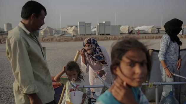 In neighbouring Salah al-Din province, nearly half of those displaced around its capital Tikrit — Saddam’s hometown — said they had been blocked from returning by Shiite militias, according to the IOM survey. Southwest of Baghdad, thousands of Sunni Arabs have been unable to return to Jurf al-Sakhar, a Sunni pocket in mainly Shiite Babel province that controls the gateway to the Shiite holy cities of Najaf and Karbala. Shiite militias drove IS militants from the area in 2014. (Bram Janssen / AP) In neighbouring Salah al-Din province, nearly half of those displaced around its capital Tikrit — Saddam’s hometown — said they had been blocked from returning by Shiite militias, according to the IOM survey. Southwest of Baghdad, thousands of Sunni Arabs have been unable to return to Jurf al-Sakhar, a Sunni pocket in mainly Shiite Babel province that controls the gateway to the Shiite holy cities of Najaf and Karbala. Shiite militias drove IS militants from the area in 2014. (Bram Janssen / AP)