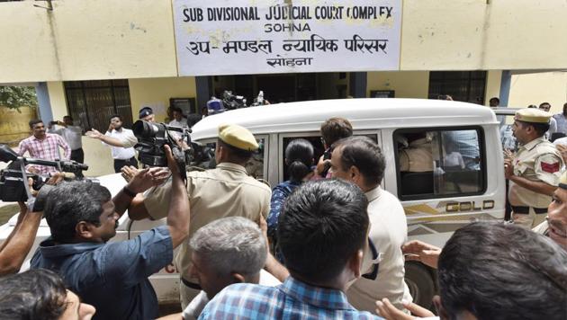 Fourty two-year-old Ashok Kumar, who allegedly slit the throat of an eight-year-old in Ryan International School, Bhondsi, on Friday morning was produced before a court on Tuesday.(Sanjeev Verma/HT PHOTO)