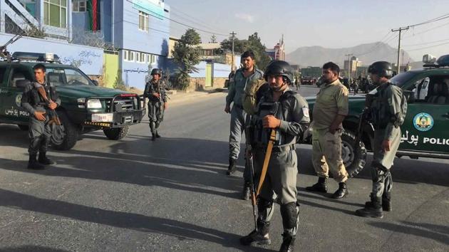 Afghan security police stand guard near the site of a deadly suicide attack outside a cricket stadium in Kabul on September 13, 2017.(AP)