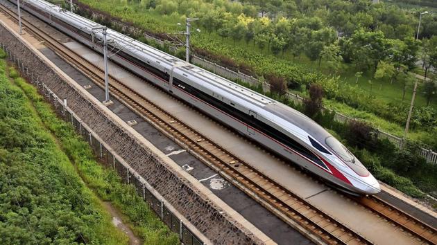 In this Aug. 21, 2017 photo released by China's Xinhua News Agency, a Fuxing bullet train, China's latest high-speed train, arrives at a train station in northern China's Tianjin Municipality.(AP)