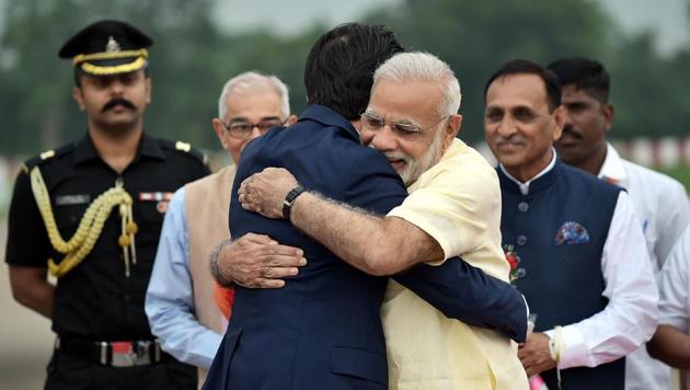 This handout photograph released by the Press Information Bureau (PIB) shows Prime Minister Narendra Modi (R) hugs Japanese Prime Minister Shinzo Abe at Ahmedabad airport.(AFP) This handout photograph released by the Press Information Bureau (PIB) shows Prime Minister Narendra Modi (R) hugs Japanese Prime Minister Shinzo Abe at Ahmedabad airport.(AFP)