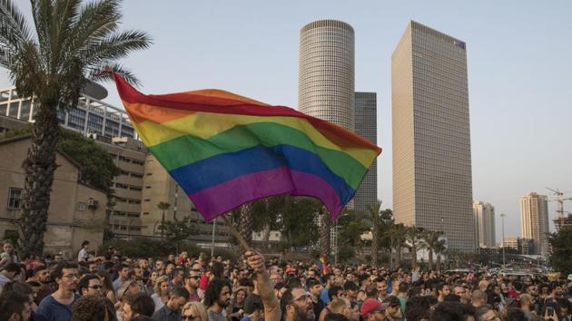 An Israeli man waves a rainbow flag during a demonstration in Tel Aviv, Israel on July 20. Though the country is considered a trailblazer in the promotion of and respect for gay rights, homosexuality remains taboo among the religious and ultra-Orthodox parties. (AP File Photo) An Israeli man waves a rainbow flag during a demonstration in Tel Aviv, Israel on July 20. Though the country is considered a trailblazer in the promotion of and respect for gay rights, homosexuality remains taboo among the religious and ultra-Orthodox parties. (AP File Photo)