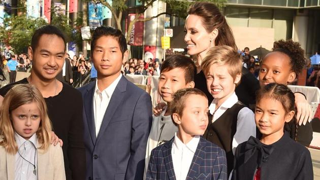 (L-R) Loung Ung, Vivienne Jolie-Pitt, Maddox Jolie-Pitt, Pax Jolie-Pitt, Angelina Jolie, Kimhak Mun, Knox Jolie-Pitt, Shiloh Jolie-Pitt, Zahara Jolie-Pitt and Sareum Srey Moch attend the First They Killed My Father premiere during the 2017 Toronto International Film Festival at Princess of Wales Theatre.(AFP)