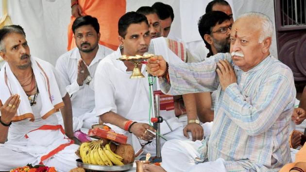 RSS chief Mohan Bhagwat offers prayers as he celebrates his birthday with sadhus, Haridwar, September 11(PTI)