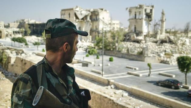 A Syrian soldier guards streets in Aleppo, Syria, on Tuesday, Sept. 12, 2017. R(AP)