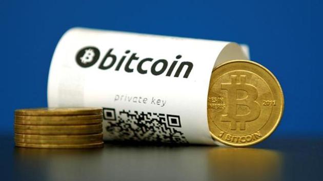 A Bitcoin (virtual currency) paper wallet with QR codes and a coin are seen in an illustration picture taken at La Maison du Bitcoin in Paris on May 27, 2015. (REUTERS file photo) A Bitcoin (virtual currency) paper wallet with QR codes and a coin are seen in an illustration picture taken at La Maison du Bitcoin in Paris on May 27, 2015. (REUTERS file photo)