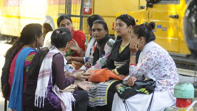 Parents waiting for their wards outside school. (HT Photo) Parents waiting for their wards outside school. (HT Photo)