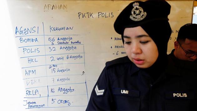 A policewoman stands next to a noticeboard, accounting for manpower involved in the aftermath of a fire at religious school Darul Quran Ittifaqiyah in Kuala Lumpur. More than 60 percent of Malaysia’s population of about 30 million are Muslim, and the country is also home to substantial ethnic Chinese and Indian minorities. (REUTERS) A policewoman stands next to a noticeboard, accounting for manpower involved in the aftermath of a fire at religious school Darul Quran Ittifaqiyah in Kuala Lumpur. More than 60 percent of Malaysia’s population of about 30 million are Muslim, and the country is also home to substantial ethnic Chinese and Indian minorities. (REUTERS)