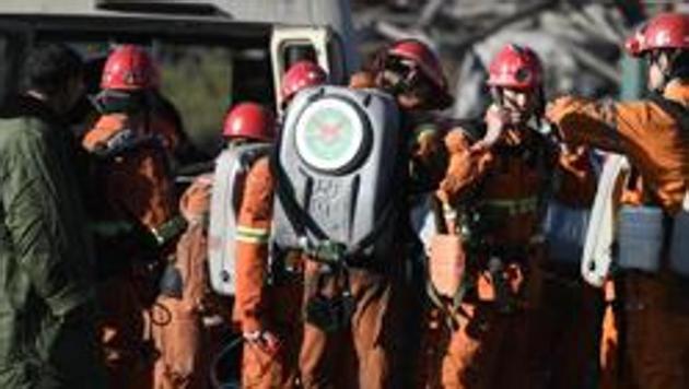 In this photo released by China's Xinhua News Agency, rescuers prepare to enter a coal mine in Shizuishan in northwestern China's Ningxia Hui Autonomous Region Wednesday, Sept. 28, 2016.(AP File Photo)