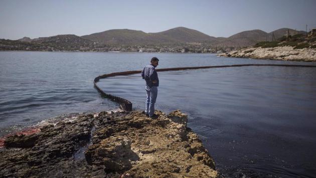 It was not immediately clear what caused the sinking late on Sunday. Weather conditions in the area were mild at the time and the vessel was anchored. (Angelos Tzortzinis / AFP) 