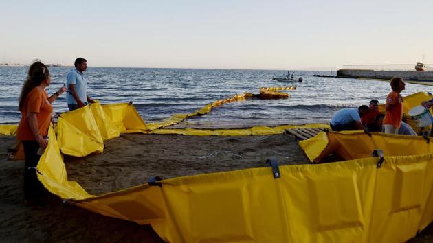 Barriers have been erected to contain the spill and tanker trucks are being used to collect the oil. ‘This leak happened near the country’s biggest harbour, just miles away from the operation centre of the ministry tasked with addressing such disasters,’ Dimitris Ibrahim, campaign director at Greenpeace Greece, told news portal in.gr. Adding insult to injury, the amount of oil in question was ‘relatively small,’ Ibrahim said. (Lousia Gouliamaki / AFP) 