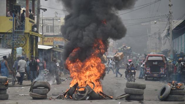 Protesters directed their anger toward senators who voted for the 2017-2018 budget last week, and the deputies who approved it Saturday -- but some expressed grievances based on false information. ‘The revolution has just started. Jovenel Moise will have to retract his taxes or he will have to leave immediately,’ said Jacques Menard, a 31-year-old protester. ‘And this is a warning because the next phase can be very violent.’ (Hector Retamal / AFP) Protesters directed their anger toward senators who voted for the 2017-2018 budget last week, and the deputies who approved it Saturday -- but some expressed grievances based on false information. ‘The revolution has just started. Jovenel Moise will have to retract his taxes or he will have to leave immediately,’ said Jacques Menard, a 31-year-old protester. ‘And this is a warning because the next phase can be very violent.’ (Hector Retamal / AFP)