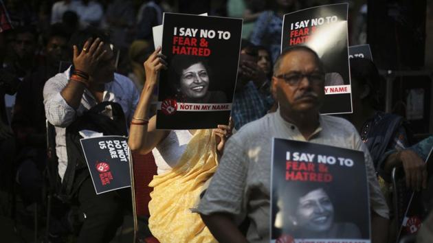 Protesters hold placards as they participate in a protest condemning the killing of journalist Gauri Lankesh in New Delhi, on September 7, 2017. (AP Photo)