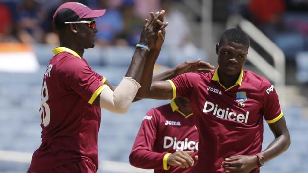 West Indies' bowler Alzarri Joseph, right, celebrates with captain Jason Holder the dismissal of India's Shikhar Dhawan during their fifth ODI at the Sabina Park cricket ground in Kingston, Jamaica, Thursday, July 6, 2017. West Indies are still not sure of qualifying for the 2019 Cricket World Cup in UK. (AP) West Indies' bowler Alzarri Joseph, right, celebrates with captain Jason Holder the dismissal of India's Shikhar Dhawan during their fifth ODI at the Sabina Park cricket ground in Kingston, Jamaica, Thursday, July 6, 2017. West Indies are still not sure of qualifying for the 2019 Cricket World Cup in UK. (AP)
