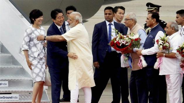 Prime Minister Narendra Modi went to Sardar Vallabhbhai International airport to receive his Japanese counterpart. PM Abe was welcomed with ceremonial reception on his arrival at the airport and was presented a guard of honour. Abe’s aircraft had the tricolour along with the Japanese flag. (PTI) Prime Minister Narendra Modi went to Sardar Vallabhbhai International airport to receive his Japanese counterpart. PM Abe was welcomed with ceremonial reception on his arrival at the airport and was presented a guard of honour. Abe’s aircraft had the tricolour along with the Japanese flag. (PTI)