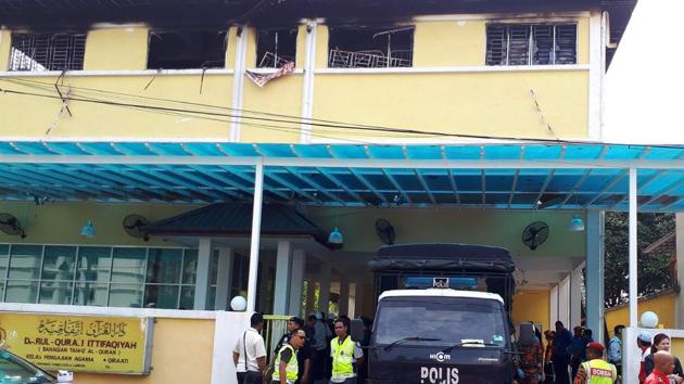 According to a report, many of the bodies of the victims , who included 22 boys aged between 13 and 17, were found piled on top of one another, indicating that there may have been a stampede as students sought to escape the blaze that erupted before dawn. (PATRICK LEE / AFP) According to a report, many of the bodies of the victims , who included 22 boys aged between 13 and 17, were found piled on top of one another, indicating that there may have been a stampede as students sought to escape the blaze that erupted before dawn. (PATRICK LEE / AFP)