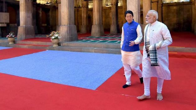 Prime Minister Narendra Modi and Japanese Prime Minister Shinzo Abe during a visit to the Sidi Saiyyed Mosque in Ahmedabad on Wednesday.(PTI Photo)