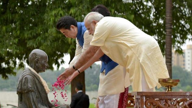 Soon after the arrival of PM Abe and Japan’s first lady, Akie Abe, in Ahmedabad they visited the Sabarmati Ashram along with Prime Minister Narendra Modi on Wednesday. The trio also paid floral tribute at the Mahatma Gandhi’s statue. (PTI) Soon after the arrival of PM Abe and Japan’s first lady, Akie Abe, in Ahmedabad they visited the Sabarmati Ashram along with Prime Minister Narendra Modi on Wednesday. The trio also paid floral tribute at the Mahatma Gandhi’s statue. (PTI)