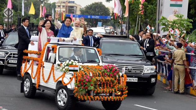 After the grand welcome Prime Minister Narendra Modi, Japanese Prime Minister Shinzo Abe and his wife Akie Abe were off for an 8-km roadshow to the Sabarmati Asharam from an open vehicle in Ahmedabad yesterday.. (PTI) After the grand welcome Prime Minister Narendra Modi, Japanese Prime Minister Shinzo Abe and his wife Akie Abe were off for an 8-km roadshow to the Sabarmati Asharam from an open vehicle in Ahmedabad yesterday.. (PTI)