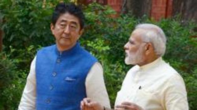 Prime Minister Narendra Modi with Japanese Prime Minister Shinzo Abe at Gandhi Ashram in Ahmedabad on Wednesday.(PTI Photo)