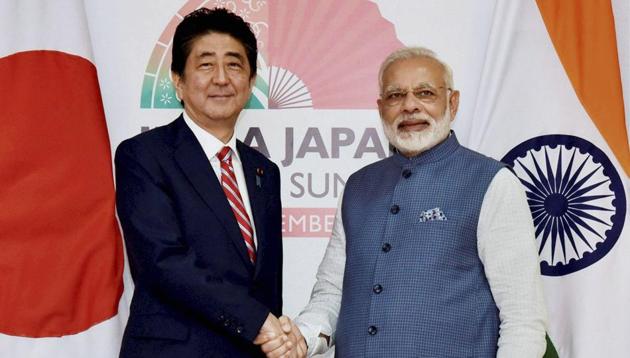 Prime Minister Narendra Modi with his Japanese counterpart Shinzo Abe ahead of India- Japan annual summit at Mahatma Mandir, in Gandhinagar on Thursday. (PTI Photo) Prime Minister Narendra Modi with his Japanese counterpart Shinzo Abe ahead of India- Japan annual summit at Mahatma Mandir, in Gandhinagar on Thursday. (PTI Photo)