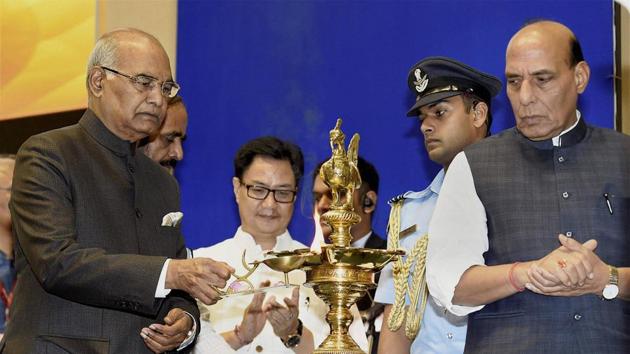 President Ram Nath Kovind lights the lamp as Union Home Minister Rajnath Singh and Minister of State for Home Affairs Kiren Rijiju look on, at the presentation ceremony of the Rajbhasha Awards for the Year 2016-17 on the occasion of Hindi Divas, in New Delhi on Thursday. (PTI) President Ram Nath Kovind lights the lamp as Union Home Minister Rajnath Singh and Minister of State for Home Affairs Kiren Rijiju look on, at the presentation ceremony of the Rajbhasha Awards for the Year 2016-17 on the occasion of Hindi Divas, in New Delhi on Thursday. (PTI)
