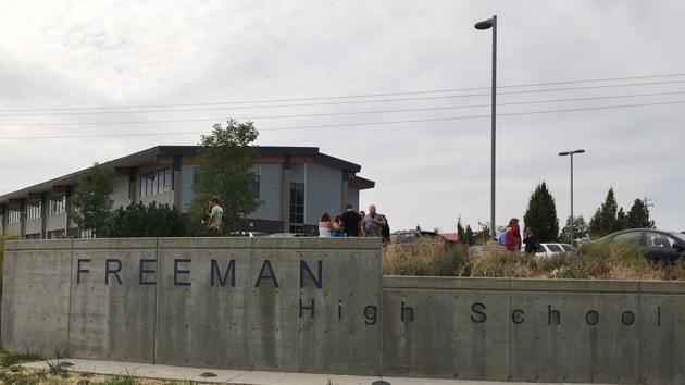People gather outside of Freeman High School after reports of a shooting at the school in Rockford, Washington, Wednesday, Sept. 13, 2017.(AP Photo)