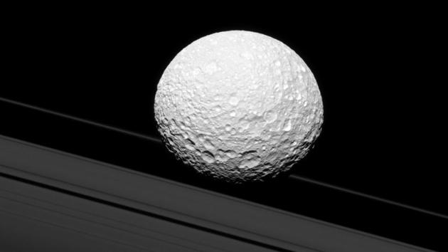 It may look as though Saturn’s moon Mimas is crashing through the rings in this image taken by NASA’s Cassini spacecraft, but Mimas is actually 28,000 miles (45,000 kilometers) away from the rings. There is a strong connection between the icy moon and Saturn’s rings, though. Gravity links them together and shapes the way they both move. (NASA/JPL-Caltech/Space Science Institute) 