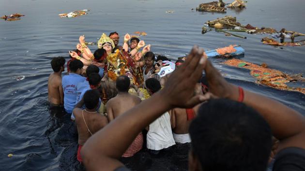Idols from nearly 200 Durga Pujas from across Delhi, Gurgaon, Noida, Ghaziabad and Faridabad are immersed at different Yamuna ghats every year.(Ravi Choudhary/HT PHOTO)