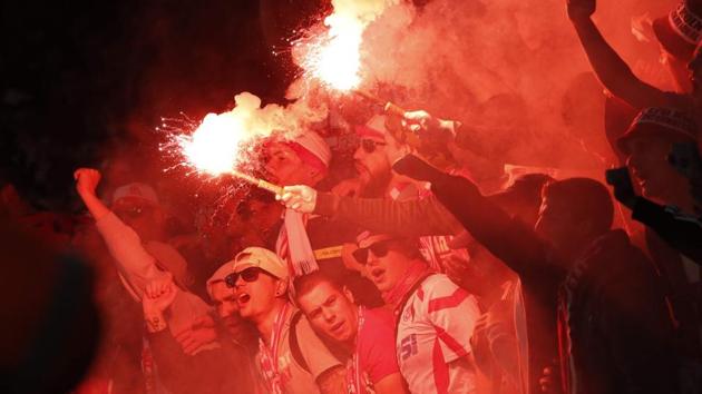 Cologne fans light flares inside the stadium during the UEFA Europa League Group H football match between Arsenal and F.C. Cologne at The Emirates Stadium in London. (AFP) Cologne fans light flares inside the stadium during the UEFA Europa League Group H football match between Arsenal and F.C. Cologne at The Emirates Stadium in London. (AFP)