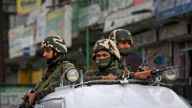 Security personnel guard after a brief encounter with militants at Aribagh Nowgam on the outskirts of Srinagar.(PTI Photo) Security personnel guard after a brief encounter with militants at Aribagh Nowgam on the outskirts of Srinagar.(PTI Photo)