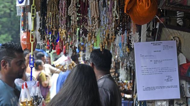 Stall owners display permits at their booths outside Mount Mary church in Bandra on Thursday. (Shashi S Kashyap/HT PHOTO) Stall owners display permits at their booths outside Mount Mary church in Bandra on Thursday. (Shashi S Kashyap/HT PHOTO)