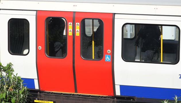 Armed police officers walk through a carriage of a London underground tube train at Parsons Green station in London. ‘Deputy Assistant Commissioner Neil Basu, the senior national coordinator for CT policing, has declared it a terrorist incident,’ the Metropolitan Police said in a statement. (Hannah McKay / REUTERS)
