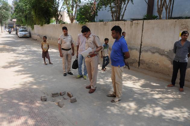 The police said the incident took place around 11.45am when five unidentified men came on two bikes and fired six bullets at the woman near Global Fields School in Naharpur Rupa.(Parveen Kumar/HT Photo)