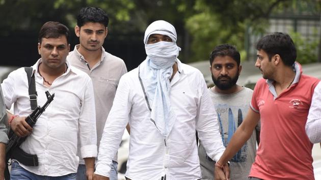 Police captured Satyawan Sehrawat alias Sonu Dariyapur, the capital’s most wanted criminal, after a dramatic shootout and chase at Narela in outer Delhi on Thursday morning. (Sonu Mehta/HT PHOTO) Police captured Satyawan Sehrawat alias Sonu Dariyapur, the capital’s most wanted criminal, after a dramatic shootout and chase at Narela in outer Delhi on Thursday morning. (Sonu Mehta/HT PHOTO)