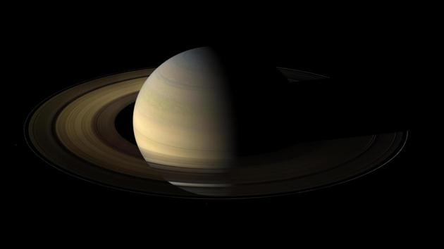 Of the countless equinoxes Saturn has seen since the birth of the solar system, this one, captured in a mosaic of light and dark, is the first witnessed up close by an emissary from Earth. This mission is  a joint endeavour of NASA, ESA (the European Space Agency), and the Italian Space Agency -- is the first mission to orbit Saturn and explore its environs in detail. (NASA/JPL-Caltech/Space Science Institute/AP) 