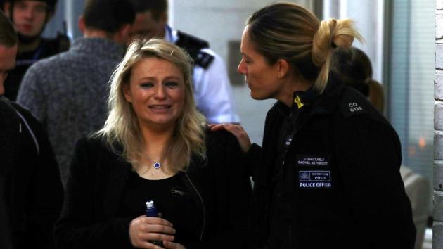 A woman reacts outside Parsons Green tube station in London, Britain. (Reuters Photo) A woman reacts outside Parsons Green tube station in London, Britain. (Reuters Photo)