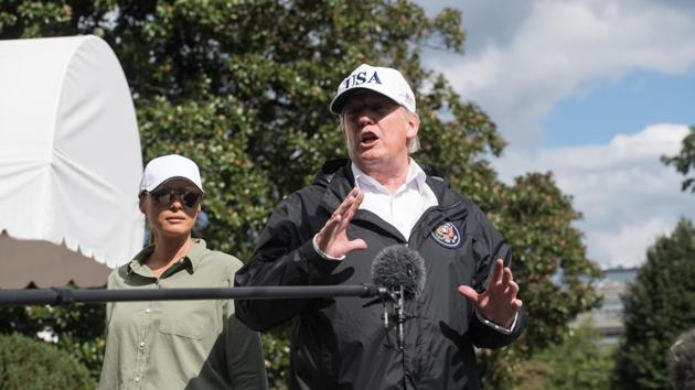 US President Donald Trump speaks to the press with First Lady Melania Trump at the White House in Washington, DC, on September 14, 2017, upon return from Florida following Hurricane Irma. (AFP)